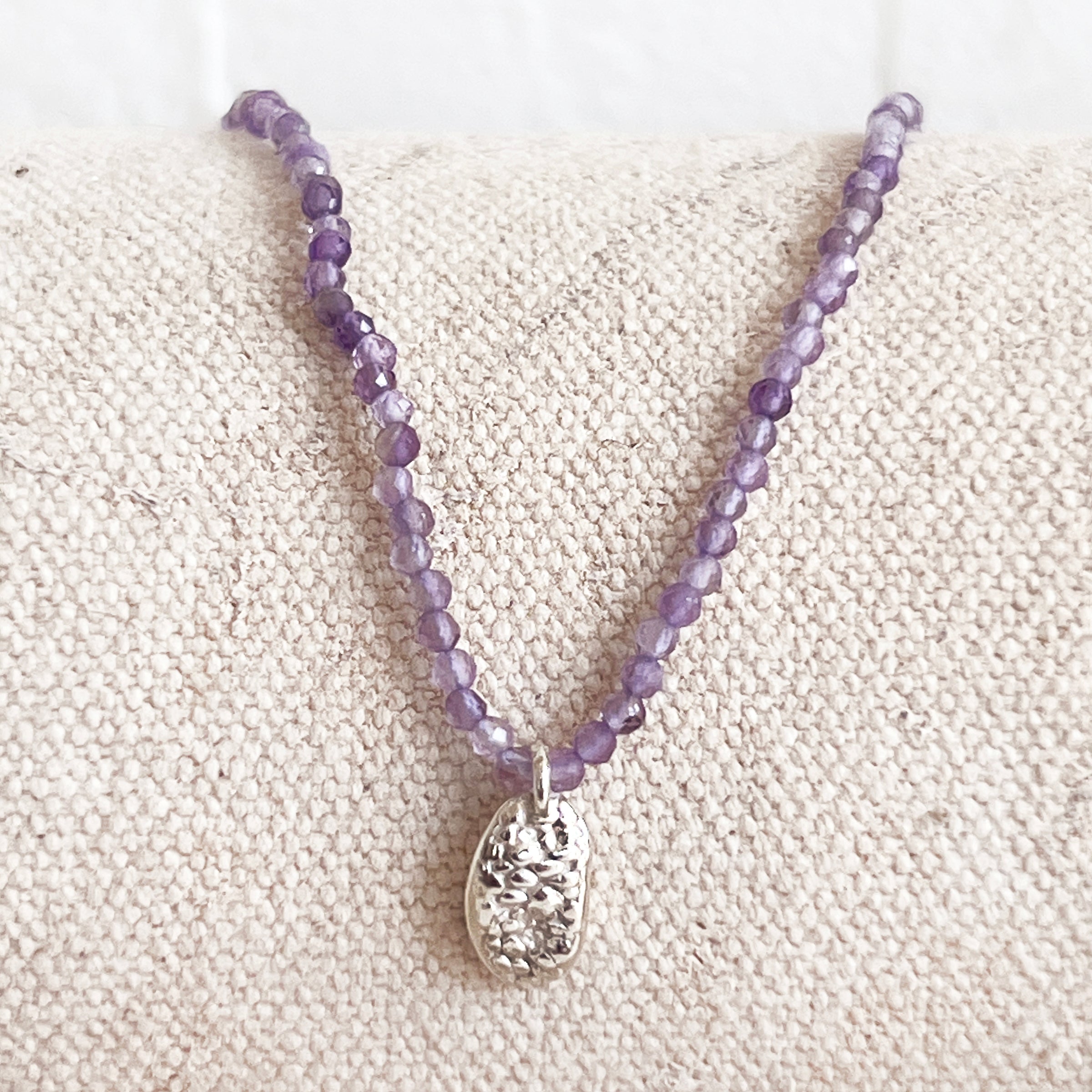 Faceted Amethyst Necklace with Limpet Charm