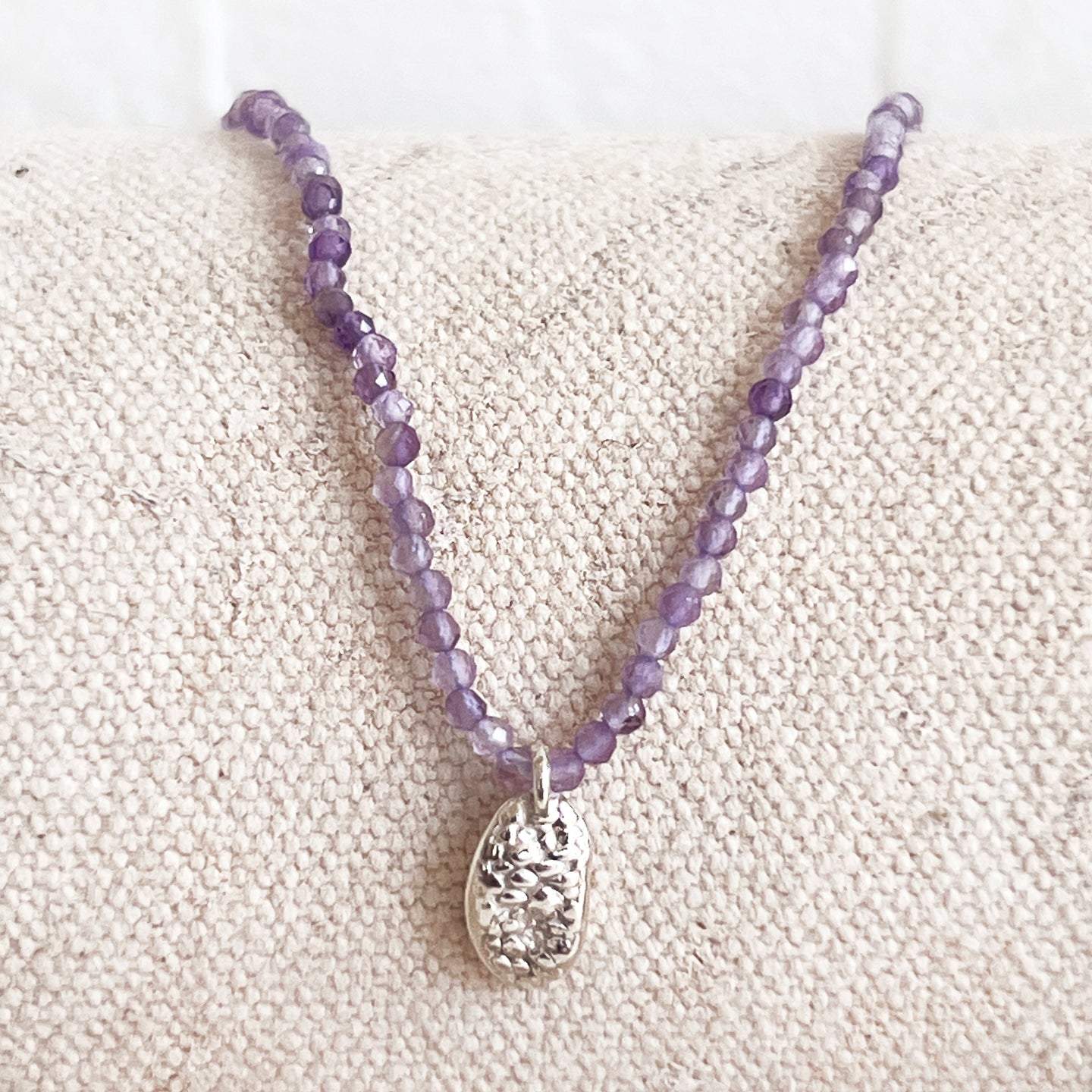 Faceted Amethyst Necklace with Limpet Charm